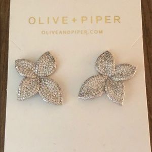 These are flower silver earrings with pave detail.